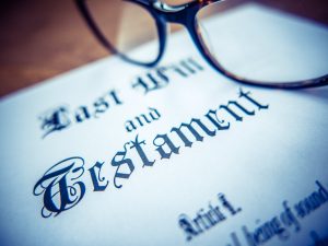 last will and testament document with glasses sitting on top that includes details of digital assets